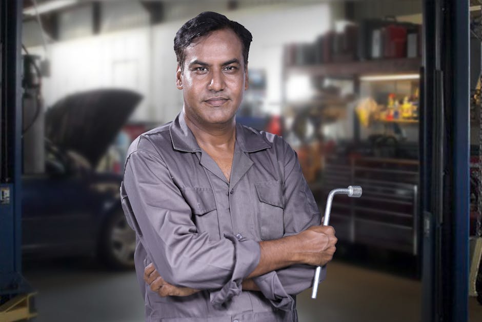 Friendly auto mechanic reviewing service details