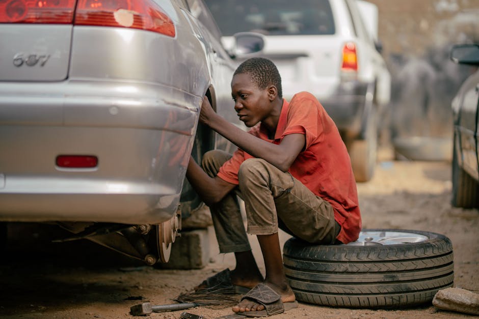 Mechanic performing a tire installation on a vehicle